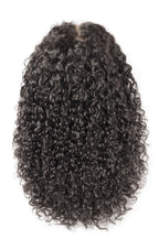 A coily textured wig in natural black color, displayed from the top showing the volume and curl of the hair.